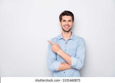 Portrait of positive cheerful guy promoter point index finger recommend ads select suggest adverts  wear casual style clothes isolated over grey color background - Shutterstock ID 1531460873