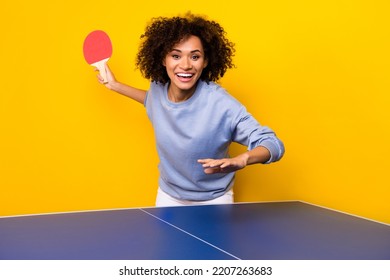 Portrait of positive cheerful person hold ping pong racket playing tennis isolated on yellow color background - Powered by Shutterstock