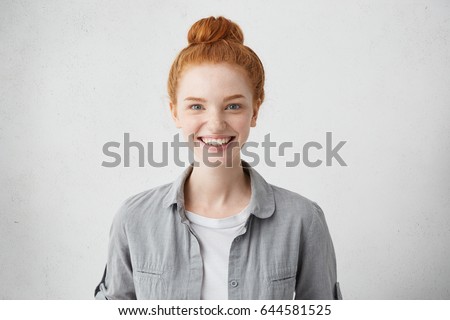 Portrait of positive cheerful teenage girl feeling happy, smiling broadly at camera after boy she likes returned her love and asked her out on date. Human facial expressions, emotions and feelings