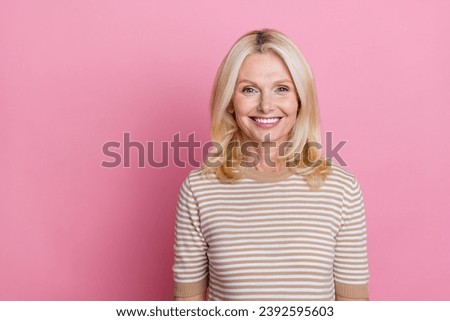 Portrait of positive cheerful woman with stylish hairdo wear trendy clothes toothy smiling at camera isolated on pink color background