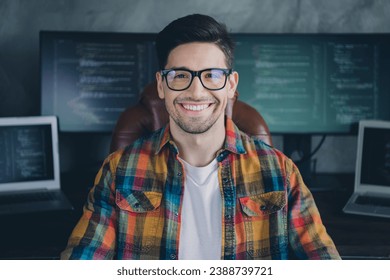 Portrait of positive clever server optimization expert sitting chair operate research netbook pc display desktop office indoors