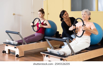 Portrait of a positive and confident latin american woman standing in a fitness studio with a fitball in her hands - Powered by Shutterstock