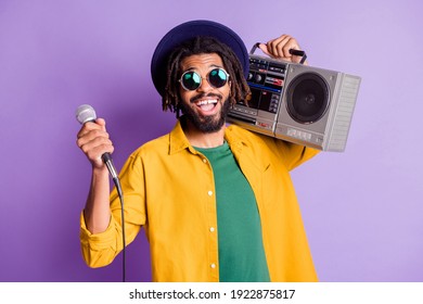 Portrait Of Positive Dark Skin Person Front Teeth Gap Smile Hold Boom Box Mic Isolated On Purple Color Background