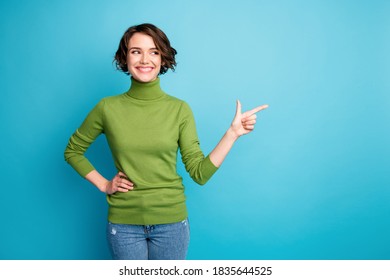 Portrait Of Positive Girl Promoter Point Index Finger Copyspace Display, Adverts Promotion Pick Tips Wear Jumper Isolated Over Blue Color Background