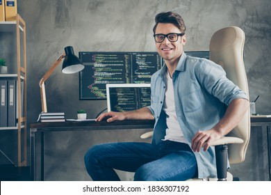 Portrait Of Positive Guy It Specialist Sit Chair Desk Enjoy Working Pc Home Ready Debugging Java Script Cyber Space Error Wear Denim Jeans Shirt In Workplace