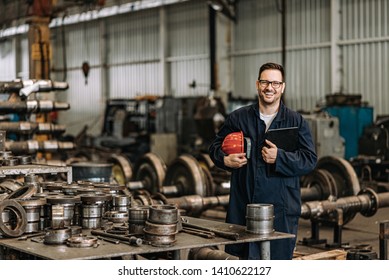 Portrait Of A Positive Handsome Train Factory Worker.