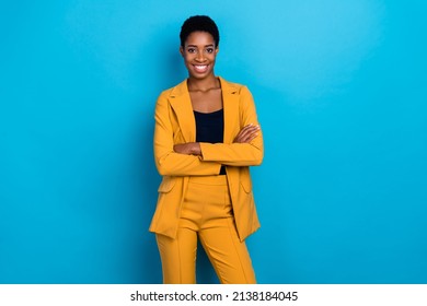 Portrait of positive lady folded arms toothy smile look camera isolated on blue color background - Powered by Shutterstock