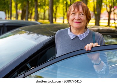 Portrait Of Positive Mature Woman, About To Get Into Her Car