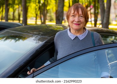 Portrait Of Positive Mature Woman, About To Get Into Her Car