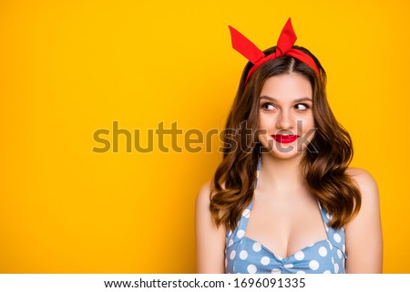 Portrait of positive pretty charming girl want meet popular guy feel shy look copyspace wear polka-dot singlet isolated over bright shine color background