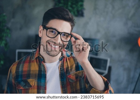 Portrait of positive smart cyber security expert guy toothy smile arm touch glasses modern office workplace indoors