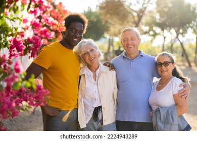 Portrait Of Positive Smiling Mature People Outdoors Together