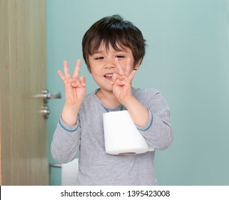 Portrait Of Preschool Boy  Showing Six Fingers,  Kid Primary School Counting Number Six, Child Wearing Pajamas Showing Finger While Carry Toilet Roll, ,Toddler Development Concept