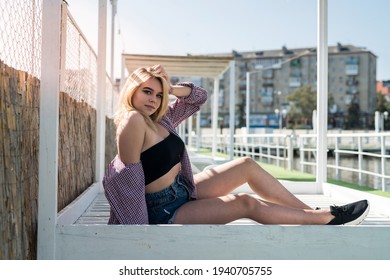 portrait of pret woman sitting on wooden chair, enjoy summer hot sunny day - Shutterstock ID 1940705755