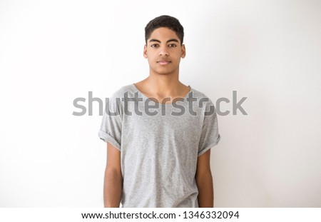 Portrait of a pretty African American boy. Black young teen man on a white background. 