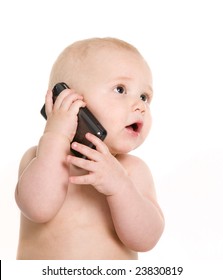 Portrait of pretty baby talking on mobile phone. Isolated over white