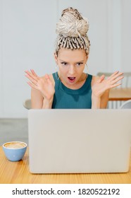 Portrait Of A Pretty Beautiful Fashionista In A Surprised Mood At The Computer