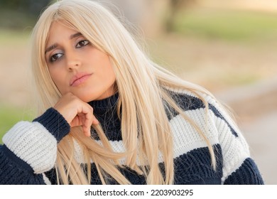 Portrait Of Pretty Blonde Girl Outdoors In Autumn