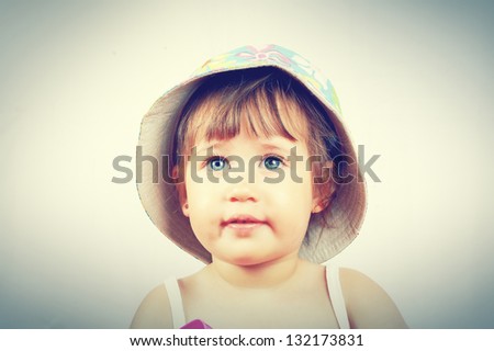 Similar – beautiful baby looking very funny into the the camera