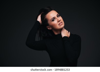 Portrait Of Pretty Brunette Girl On Black Background