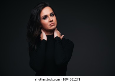 Portrait Of Pretty Brunette Girl On Black Background