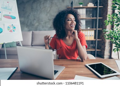 Portrait Of Pretty Cheerful Accountant Looking Away Sitting At Desk In Modern Office Dreaming About Weekend Vacation Enjoying View From Window. Positive Thinking Person Concept