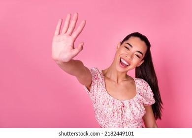 Portrait Of Pretty Excited Girl Arm Palm Give High Five Toothy Smile Isolated On Pink Color Background