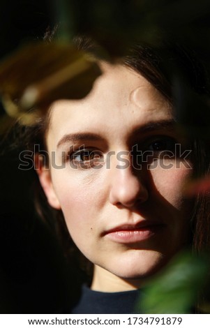 Similar – Hopeful Portrait of a Young Woman at the Window