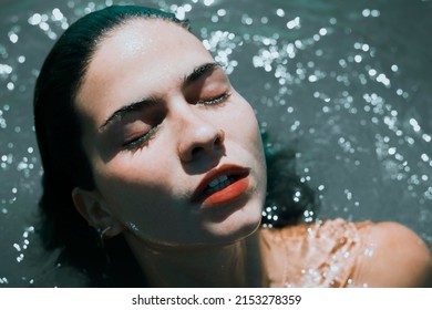 Portrait Of Pretty Girl Coming Out Of The Sea Water