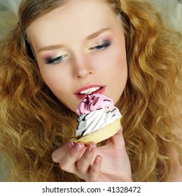 Portrait of pretty girl eating cake, close up