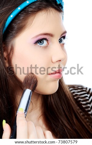Portrait of a pretty girl teenager. Isolated over white background.