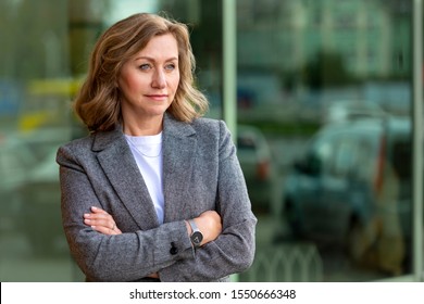 Portrait Of A Pretty Mature Business Woman 55 Years Old, Outdoors In The City.