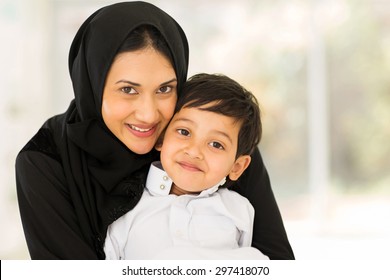 portrait of pretty muslim woman with her son