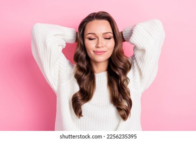 Portrait of pretty positive lady closed eyes hands behind head take nap isolated on pink color background - Shutterstock ID 2256235395