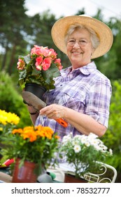 Portrait Of Pretty Senior Woman Gardening