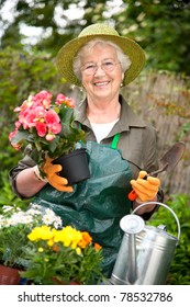 Portrait Of Pretty Senior Woman Gardening