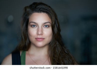 Portrait Of Pretty Woman Dark Hair, Blue Eyes