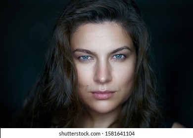Portrait of pretty woman dark hair, blue eyes. blue eyes woman. blue eyes girl, woman eyes. woman look. female face portrait