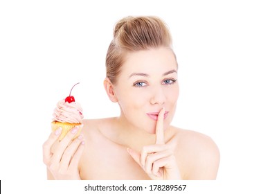 A Portrait Of A Pretty Woman Trying To Eat A Cupcake In Secret Over White Background