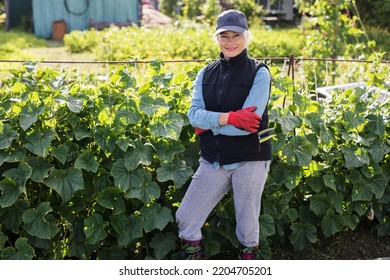 Portrait Of Pretty Young Farmer Woman Outdoor