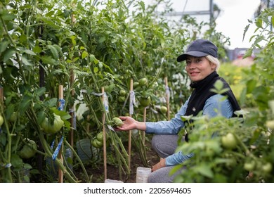 Portrait Of Pretty Young Farmer Woman Outdoor