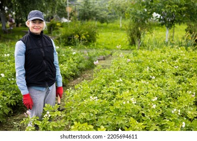 Portrait Of Pretty Young Farmer Woman Outdoor