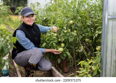 Portrait Of Pretty Young Farmer Woman Outdoor