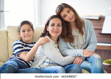 Portrait Of Pretty Young Mother With Her Two Children Adorable Teenager Daughter And Son