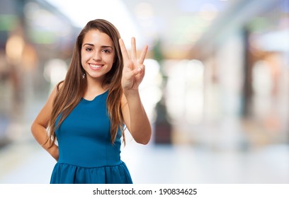 Portrait Of Pretty Young Woman Counting With Her Fingers