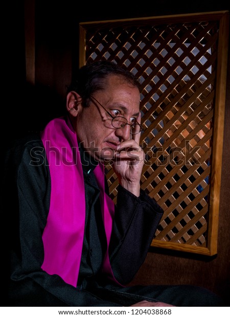 portrait-priest-his-confessional-600w-1204038868.jpg