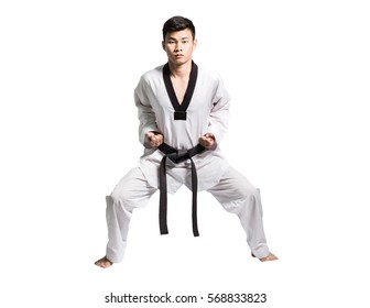 Portrait Of A Professional Asian Man Taekwondo Fighter With Black Belt On Grey Background