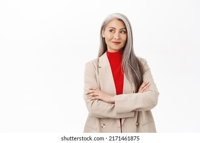 Portrait Of Professional Asian Senior Businesswoman, Cross Arms On Chest, Looking Confident, Wearing Stylish Suit, Smiling Assertive, Working In Corporate, White Background