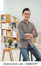 Portrait Of Professional Asian Web Designer In His Studio