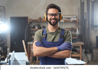 Portrait of professional male carpenter in workshop - Powered by Shutterstock